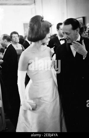 Dinner in honor of Andru00e9 Malraux, Minister of State for Cultural Affairs of France, 8:00PM. First Lady Jacqueline Kennedy visits with Minister of State for Cultural Affairs of France, Andru00e9 Malraux (right), during a dinner in his honor. Cross Hall, White House, Washington, D.C. Stock Photo