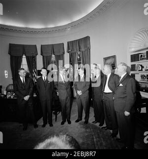 Visit of recipients of the 1962 Rockefeller Public Service Awards, 10:20AM. President John F. Kennedy visits with the recipients of the 1962 Rockefeller Public Service Awards. Listed in the Presidentu2019s schedule: President of the Federal National Mortgage Association, J. Stanley Baughman; assistant general counsel for the Department of Health, Education, and Welfare (HEW), Reginald G. Conley; National Aeronautics and Space Administration (NASA) Deputy Administrator, Hugh L. Dryden; Associate Director for Research and Development for the Census Bureau, Morris H. Hansen; Ambassador at Large, Stock Photo