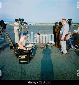 White House Communications Agency (WHCA) staff advance trip to Costa Rica. View of television film crews setting up equipment on a tarmac in Costa Rica, during a White House Communications Agency (WHCA) staff trip in advance of President John F. Kennedyu2019s visit. [Photograph by Harold Sellers] [Discoloration along right side of image is original to the negative.] Stock Photo