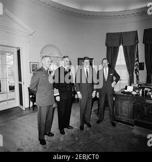 Meeting with The Earl Mountbatten, Chief of the British Defense Staff, 12:05PM. President John F. Kennedy meets with Chief of the Defense Staff of the British Armed Forces and Admiral of the Fleet, Lord Louis Mountbatten, First Earl Mountbatten of Burma. Left to right: Chairman of the Joint Chiefs of Staff, General Maxwell D. Taylor; Lord Mountbatten; President Kennedy; Ambassador of Great Britain, Sir David Ormsby-Gore. Oval Office, White House, Washington, D.C. Stock Photo
