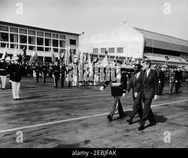 Arrival ceremony for Ahmed Su00e9kou Touru00e9, President of Guinea, 11:00AM. President John F. Kennedy and President of Guinea, Ahmed Su00e9kou Touru00e9, review honor guard troops during arrival ceremonies for President Touru00e9; an unidentified Commander of Troops walks left of the Presidents. Military Air Transport Service (MATS) terminal, Washington National Airport, Washington D.C.