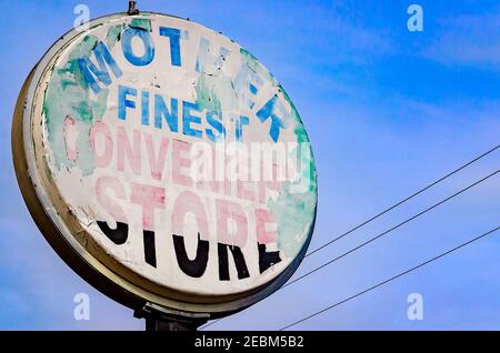 A faded sign advertises Mother’s Finest convenience store on Houston Street, Feb. 8, 2021, in Mobile, Alabama. The store was founded in 1987. Stock Photo