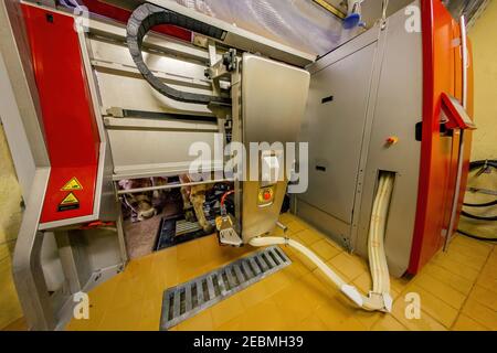 Milking the cows with a fully automated milking robot. Stock Photo