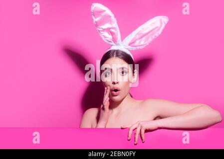 Young woman with bunny ears. Thinking surprised. Funny emotions, excited expressing. Stock Photo