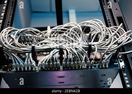 Network panel, switch and cables in data center Stock Photo