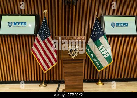 New York, United States. 12th Feb, 2021. Setup for Assistant Chief Miguel Iglesias press conference on gun charges arrests with police officers at One Police Plaza. He was joined by (not pictured) Detective Anibal Torres, Captain Rachael Kosak, Detective Kevin McGinn, Police Officer Vincent Gambino. 14 people, including 11 adults and three juveniles were arrested on party bus in downtown Brooklyn with 8 loaded guns and 58 rounds of ammunition inside the bus. (Photo by Lev Radin/Pacific Press) Credit: Pacific Press Media Production Corp./Alamy Live News Stock Photo