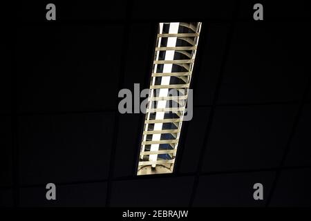 White light from Fluorescent light tube on the wall or Neon tube light.Copy space background for usage and any design. Stock Photo