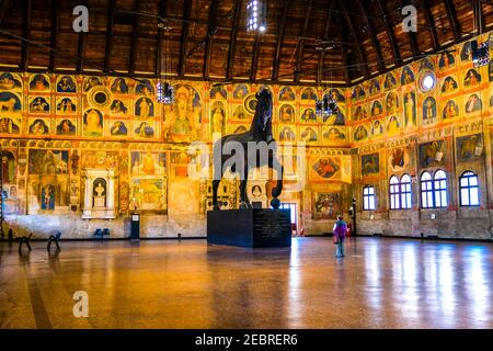 The Great Hall of Palazzo della Ragione with its vaulted ceiling, astrological inspired frescoes and equestrian statue in Padua Italy Stock Photo