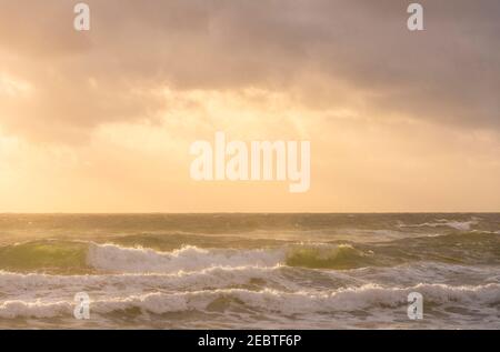 Clouds over sea at sunset Stock Photo