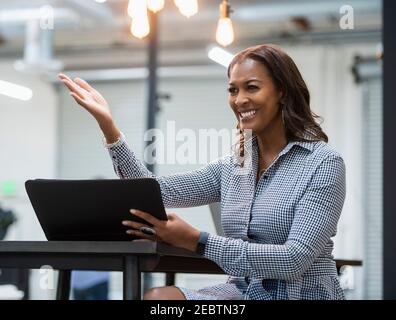 Business woman using laptop in office Stock Photo