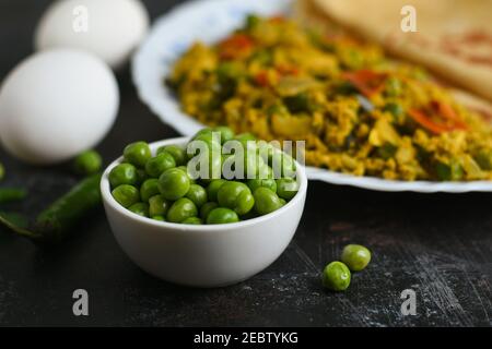 Spicy egg bhurji with Chapati ,Roti, Scrambled egg with Indian flatbread paratha , green peas lentil, protein rich breakfast food Delhi India. Masala Stock Photo