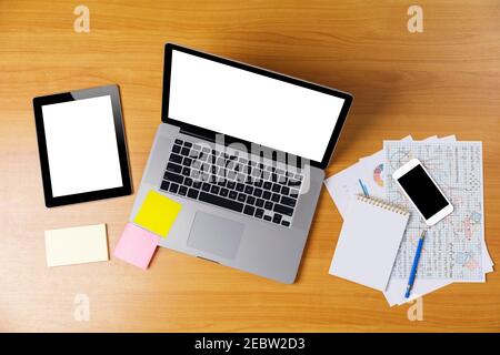 Laptop or notebook, mobilephone or smartphone, tablet with blank white screen on wood table white background save with clipping path. Laptop with empt Stock Photo