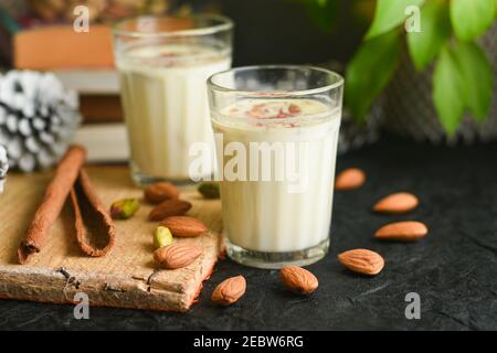 Kesar Badam milk shake or Almond Saffron milk prepared with almonds, spices and milk Kerala India. Kheer or North Indian traditional health drink Stock Photo