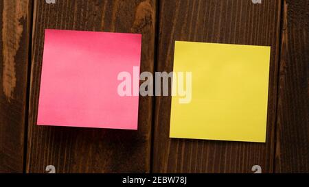 two stickers on a wooden background. stickers on the wall Stock Photo