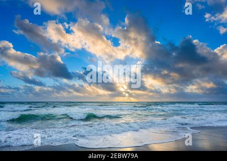 Clouds over sea at sunset Stock Photo