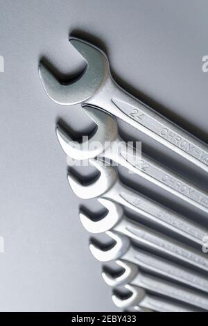 Cut-out wrenches horizontally placed from the biggest to the smallest in a row. Top view composition. Hand tool. Tools for carpentry work. Type of fas Stock Photo