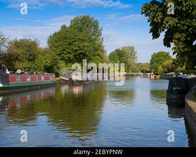 Historic barges are moored along with more modern narrowboats on the Grand Union Canal in Hertfordshire. Stock Photo