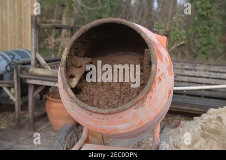 Floor Screed Being Mixed in a Cement Mixer on a Building Site in Rural Devon, England, UK Stock Photo