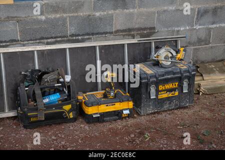 Battery Operated Rechargeable DeWalt Power Tools in a Tool Box on a Construction Site in Rural Devon, England, UK Stock Photo