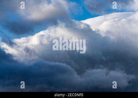 Dramatic thunderstorm clouds in blue sky before rain. Natural weather background Stock Photo