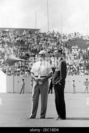 Inspection tour of NASA installations: Houston, Texas, motorcade, address at Rice University, 9:34AM. Special Assistants to President John F. Kennedy, Dave Powers and Kenneth P. Ou2019Donnell (right), stand on the field at Rice University Stadium, during President Kennedyu0027s visit to Rice University, Houston, Texas; spectators sit in the stands. Stock Photo