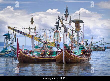 Paired buggies, historic fishing boats in the harbour at Pangambengan, Bali, Indonesia. Stock Photo