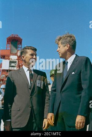 Inspection tour of NASA installations: Cape Canaveral Florida, 2:31PM. President John F. Kennedy visits with astronaut Commander Walter M. Schirra (left), during a tour of the Mercury-Atlas Launch Complex at Cape Canaveral Air Force Station, Cape Canaveral, Florida. President Kennedy visited Cape Canaveral as part of a two-day inspection tour of National Aeronautics and Space Administration (NASA) field installations. [Scratches and discoloration throughout image are original to the negative.] Stock Photo
