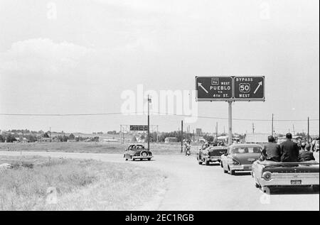 Trip to Western States: Pueblo, Colorado, 12:50PM. The motorcade for President John F. Kennedy travels through Pueblo, Colorado; President Kennedy visited Pueblo, Colorado, to commemorate the Fryingpan-Arkansas Reclamation Project. Stock Photo