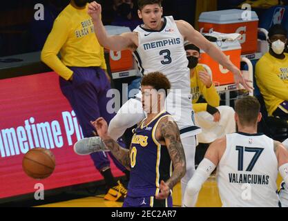 Los Angeles, United States. 13th Feb, 2021. Los Angeles Lakers' forward Kyle Kuzma chases the loose ball after blocking the shot Memphis Grizzlies' guard Grayson Allen during the second half at Staples Center in Los Angeles on Friday, February 12, 2021. The Lakers defeated the Grizzlies 115-105. Photo by Jim Ruymen/UPI Credit: UPI/Alamy Live News Stock Photo
