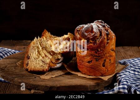 Easter cake kraffin. Kraffins with raisins, candied fruits and poppy seeds, sprinkled with powdered sugar. Close-up of homemade cake. Cruffin. Stock Photo