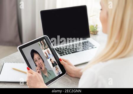 Young Female Doctor Video Chatting On Laptop In Clinic Stock Photo