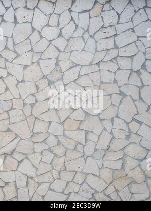 The wall is lined with light decorative tiles of various shapes. Not seamless texture Stock Photo