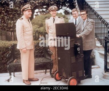 President Kennedy departs the White House for Andrews Air Force Base; White House Army Signal Agency (WHASA) staff and Kenneth P. Ou2019Donnell outside White House, 3:00PM. Four unidentified White House Army Signal Agency (WHASA) officers stand outside the South Portico of the White House, Washington, D.C. Stock Photo