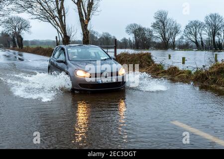 West Cork, Ireland. 13th Feb, 2021. Many parts of West Cork flooded today after a night of torrential rain. The River Ilen on the R594 near Caheragh burst its banks during the night. Credit: AG News/Alamy Live News Stock Photo