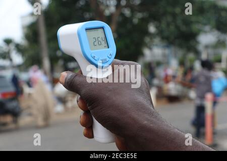 A man displaying a thermometer during Jumaat service. Due to the coronavirus pandemic in Nigeria, many religious worship places such as the Lagos central mosque, are asking their members to comply with Covid-19 preventive protocols. Lagos, Nigeria. Stock Photo