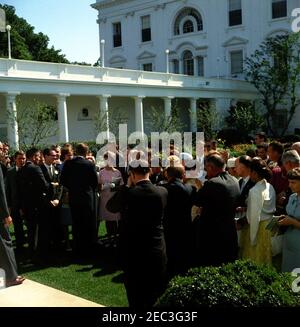 Visit of a delegation from the Foundation for the Junior Blind, 10:04AM. President John F. Kennedy (left, back to camera) visits with delegates from the Foundation for the Junior Blind, of Los Angeles, California. Rose Garden, White House, Washington, D.C. Stock Photo