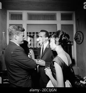 Trip to New York City: Reception, Arthur Krim Residence. President John F. Kennedy visits with singer, Harry Belafonte, and Julie Robinson Belafonte during an evening reception at the residence of Arthur B. Krim and Dr. Mathilde Krim in New York City, New York. Stock Photo