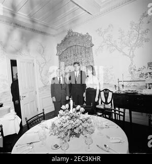 Trip to New York City: Reception, Arthur Krim Residence. President John F. Kennedy stands with Arthur B. Krim (left) and Dr. Mathilde Krim (right) during an evening reception at the Krim residence in New York City, New York. Stock Photo