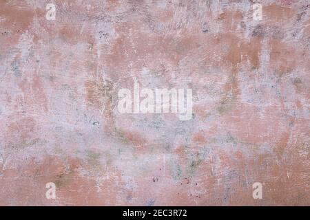Old colored cracked wall, grunge texture for design. Background of old pink painted wall Stock Photo