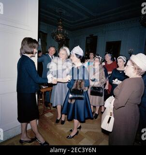 First Lady Jacqueline Kennedyu0027s (JBK) reception for the American National Theater u0026 Academy. First Lady Jacqueline Kennedy (left) greets members of the American National Theater and Academy (ANTA) before a reception in their honor. East Room, White House, Washington, D.C. Stock Photo