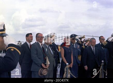 Trip to Western States: Visit to the Pacific Fleet, President Kennedy aboard the USS Oriskany, 4:00PM. View of guests standing left of reviewing platform aboard the flight deck of the aircraft carrier USS Oriskany (CVA-34) as ships from the task force perform a 21-gun salute in honor of President John F. Kennedyu0027s visit to the U.S. Pacific Fleet, at sea off the coast of San Diego, California. Those pictured include: Special Assistants to President Kennedy, Kenneth P. Ou0027Donnell and Dave Powers; Press Secretary, Pierre Salinger; Secretary to the Press Secretary, Sue Mortensen Vogelsing Stock Photo
