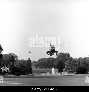 President Kennedy departs the White House for Atlantic City, New Jersey, 9:09AM. Two helicopters, one carrying President John F. Kennedy, depart from the South Lawn of the White House, Washington, D.C.; the President traveled to Andrews Air Force Base en route to Atlantic City, New Jersey. [Photograph by Harold Sellers] Stock Photo