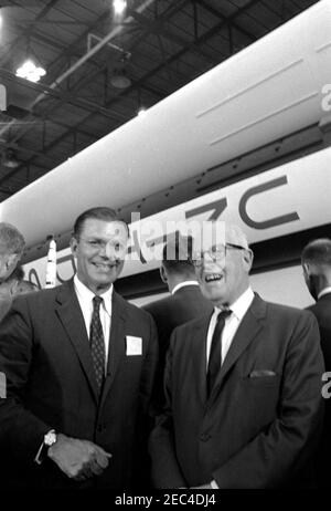 Inspection tour of NASA installations: Huntsville Alabama, Redstone Army Airfield and George C. Marshall Space Flight Center, 9:35AM. Secretary of Defense, Robert S. McNamara (left), and Representative George P. Miller (California) stand in front of an exhibit of the Saturn rocket, during President John F. Kennedyu0027s visit to the George C. Marshall Space Flight Center (MSFC) at Redstone Arsenal, Huntsville, Alabama. President Kennedy visited the MSFC as part of a two-day inspection tour of National Aeronautics and Space Administration (NASA) field installations. Stock Photo