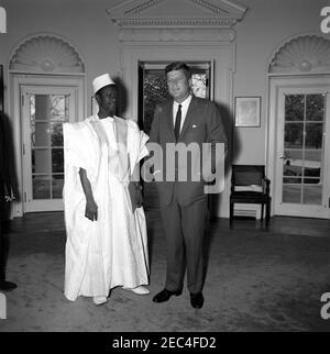 Meeting with the Ambassador of Mali, Oumar Sow, 12:08PM. President John F. Kennedy meets with the newly-appointed Ambassador of the Republic of Mali, Oumar Sow (left). Ambassador Sow presented his credentials to President Kennedy. Oval Office, White House, Washington, D.C. [Photograph by Harold Sellers] Stock Photo
