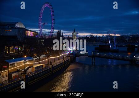 View from Waterloo Bridge looking west along the River Thames towards the Houses of Parliament at twilight, Westminster, London, England, UK Stock Photo