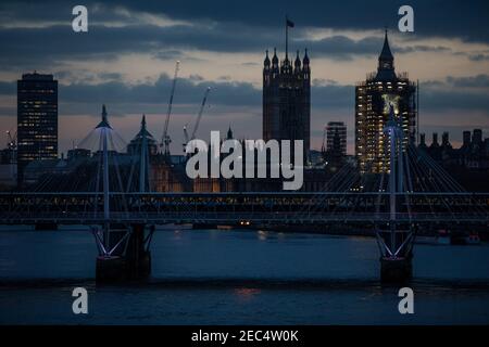 View from Waterloo Bridge looking west along the River Thames towards the Houses of Parliament at twilight, Westminster, London, England, UK Stock Photo