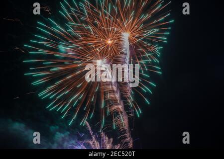 Colorful fireworks on the dark night sky Stock Photo