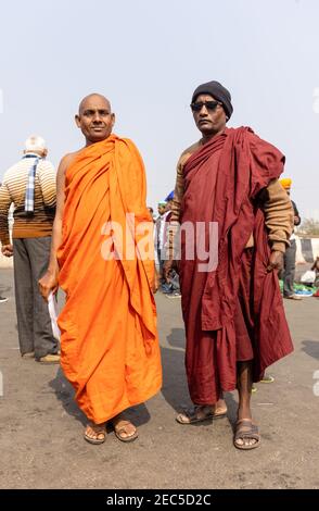 Indian children in modern dress with a lady in traditional dress in the  background.Sarnath Uttar Pradesh, India Stock Photo - Alamy