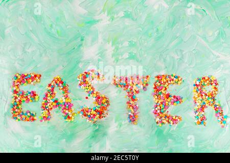 Easter text on green background with brush strokes. Spring card. Copy space Stock Photo