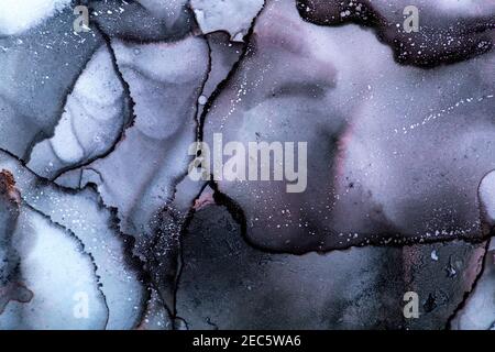 Beautiful abstract art background created with alcohol inks. Vibrant shades of pink, mauve and blue. Stock Photo